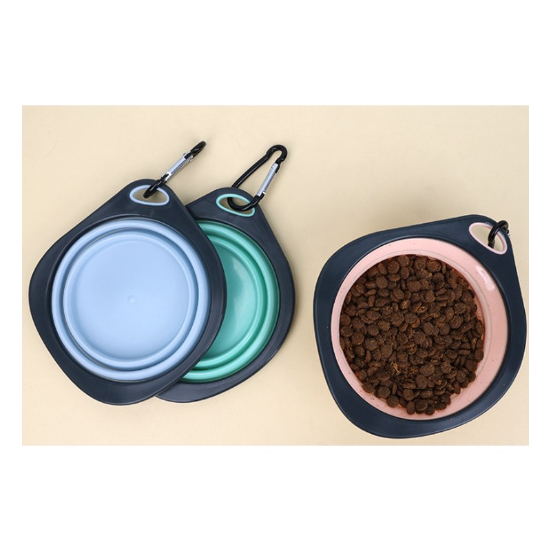 Collapsible silicone bowls in blue and black, one filled with dry food